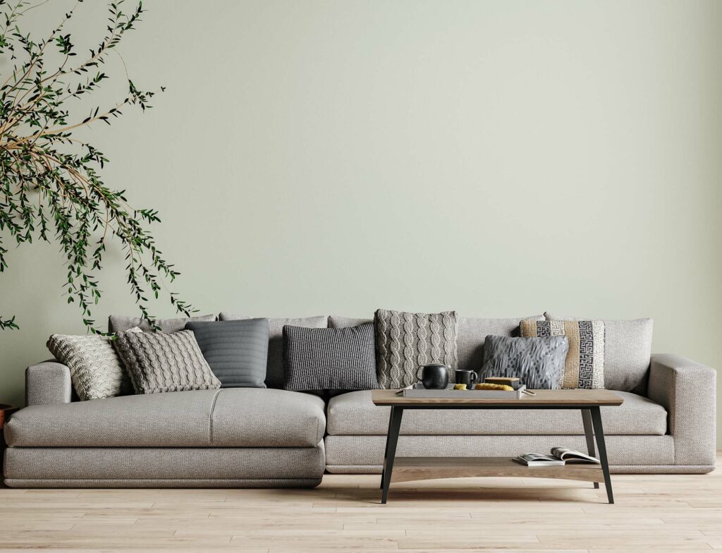 laminate flooring in living room with light green walls